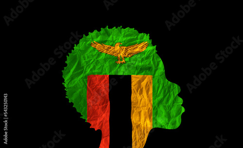 African woman silhouette with Zambia national flag. photo