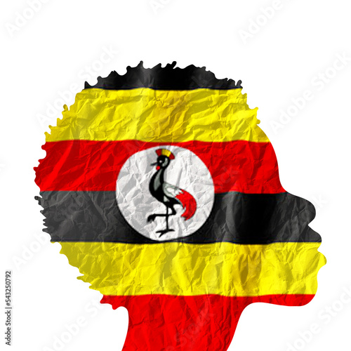 African woman silhouette with Uganda national flag. photo