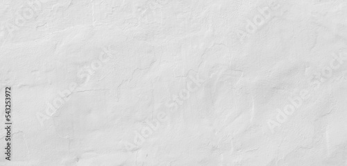 Painted white concrete wall background. Panoramic texture of a beautiful mediterranean white wall in a village