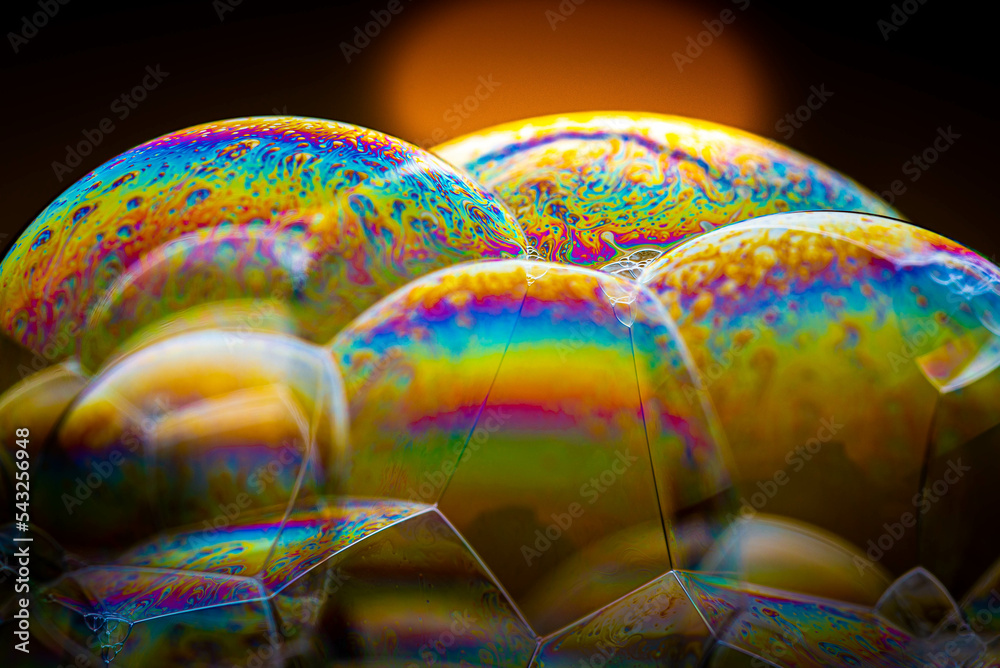 Studio macro photography of colorful soap bubbles. Detailed with many small details. Color explosion, beautiful background.