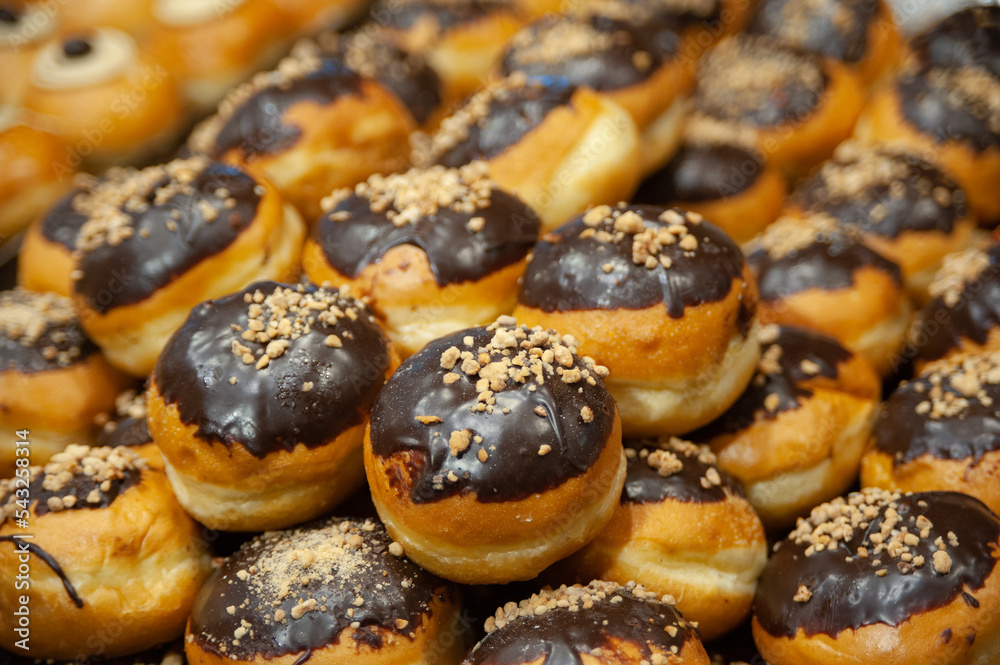 Decorative donuts in a Jerusalem bakery during the celebration of the Jewish holiday of Hanukkah, when it is traditional to eat foods fried in oil. Decorative donuts in a Jerusalem bakery during the celebration of the Jewish holiday of Hanukkah, when it is traditional to eat foods fried in oil.