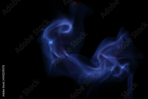 Abstract background - blue flames against black background