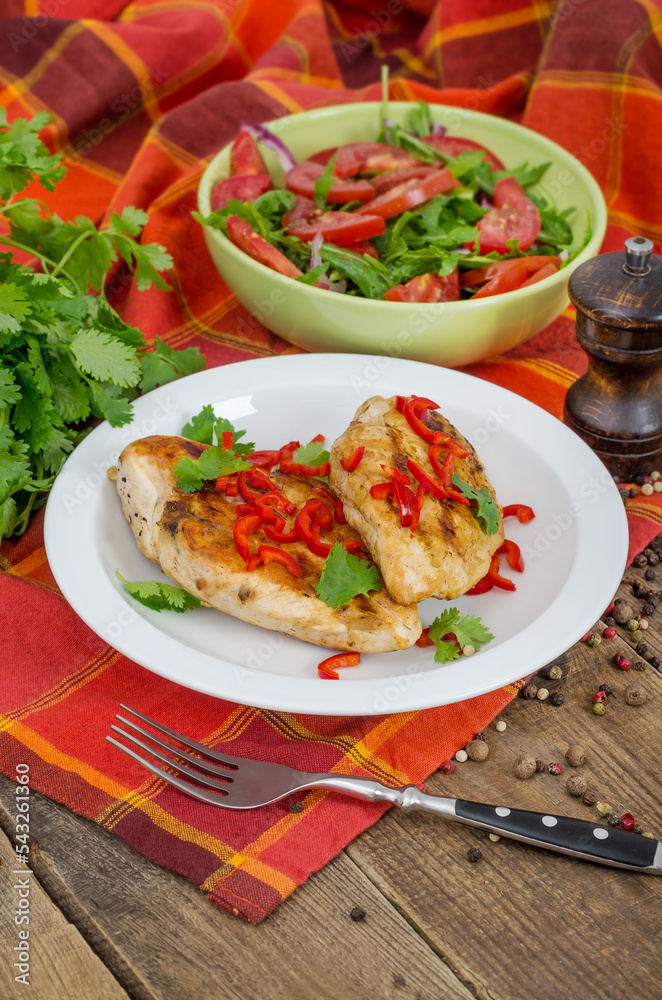 Roasted chicken meat served on wooden table Roasted chicken meat served on wooden table