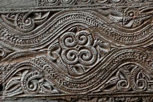 Detail of ornamentation and relief carving on the wood of a coffin at the burial site of the Tana Toraja, Tampang Allo, Sulawesi, Indonesia