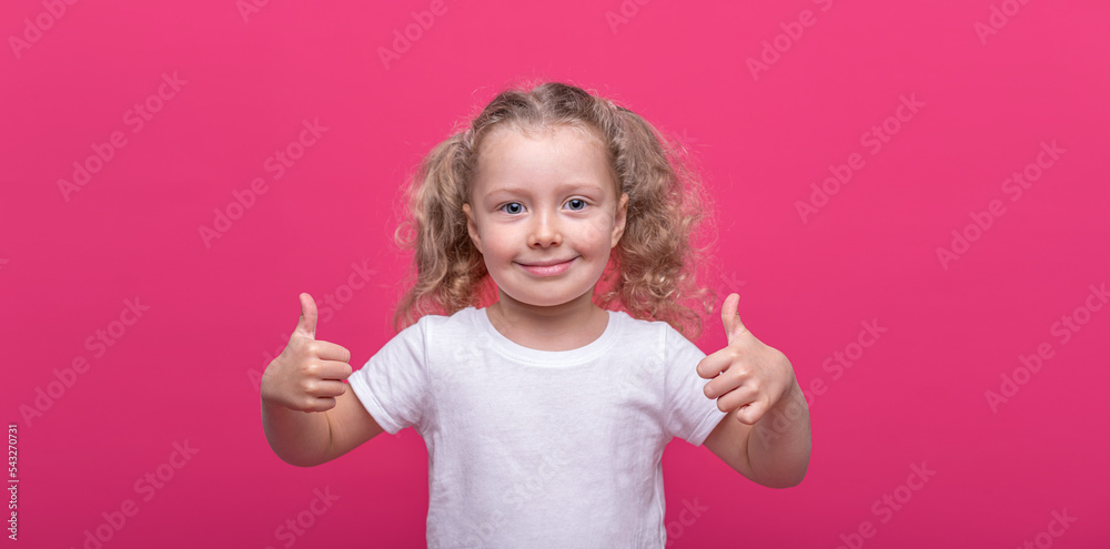Little cheerful girl on a pink background. Little cheerful girl on a pink background.
