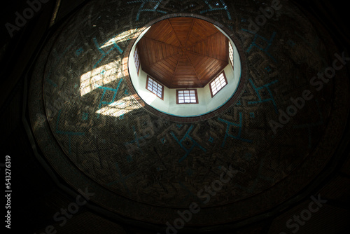Fototapeta Sunlight reflecting from the window and historical building, Konya-Turkey