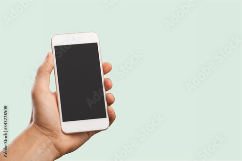 Hand with mobile phone with a blank screen