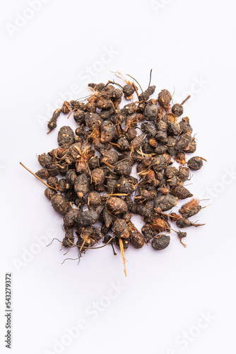 Ayurvedic Nagarmotha - Cyperus Scariosus or Cypriol in a bowl or heap