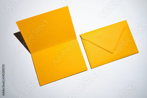 Yellow envelopes on a white background. A set of envelopes in different types. Paper envelopes for inscriptions. Top view mockup 
