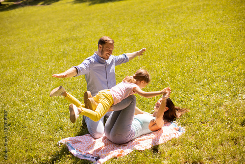 Happy young family with cut...