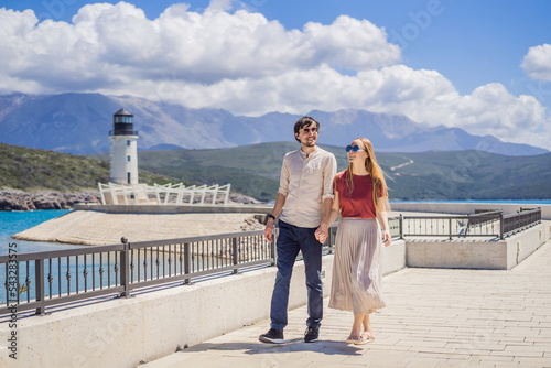 Couple in love tourists enjoying the views of Architecture and luxury yachts in Lustica Bay, Montenegro. Travel around Montenegro concept. Go Everywhere