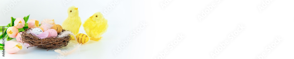 Beautiful Easter decor on a white background. Selective focus. Beautiful Easter decor on a white background. Selective focus.