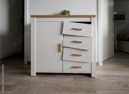 damaged mechanism for opening the drawers of the new cabinet ready for a claim
