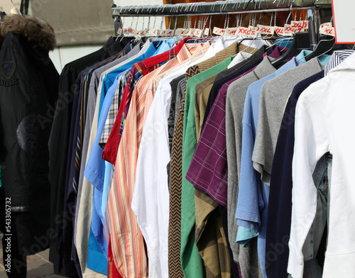 vintage clothes for sale in the stall stand at the flea market