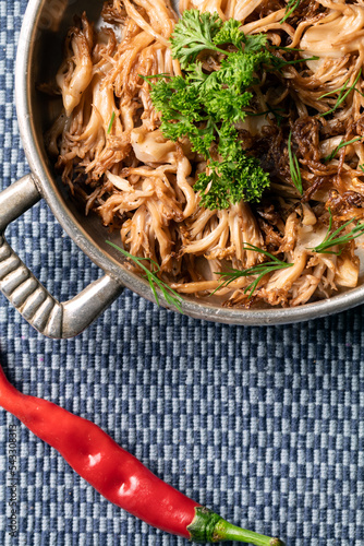 Fried Ramaria Flava, yellow coral mushrooms on silver pan. Wild mushroom, Ukraine. photo