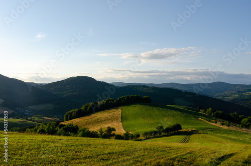 A picturesque view of mountains  forests and a colourful farmland in Slovakia.