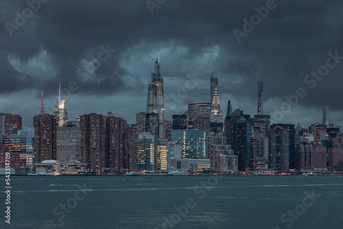 NYC Cityscape with Stormy Cloudy Blue Sky in Background