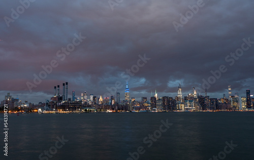 NYC Cityscape with Stormy Cloudy Blue Sky in Background