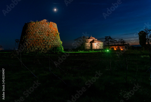 Night view of the Nuraghe and Church of Santa Sabina, located in the municipality of Silanos, Nuoro - Sardinia photo