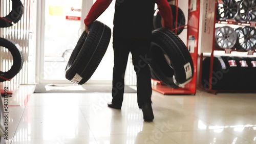 Tire fitting. Seasonal replacement of car wheels from summer to winter