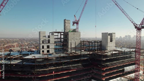 Wallpaper Mural Aerial view of cranes and construction crew building tall hospital in Midwestern city near highway and traffic Torontodigital.ca