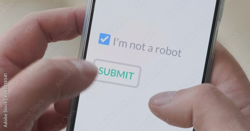 Finger taps I m not a robot checkbox on phone screen, then on submit button. Concept, technology, human check, verification. Finger taps I m not a robot checkbox on phone screen, then on submit button. Concept, technology, human check, verification.