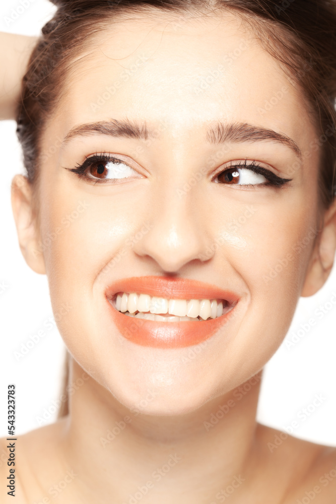 Beautiful girl close up studio portrait against white background.