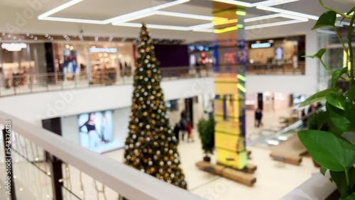 DEFOCUSED: Central HUGE christmas tree in a shopping mall in winter photo