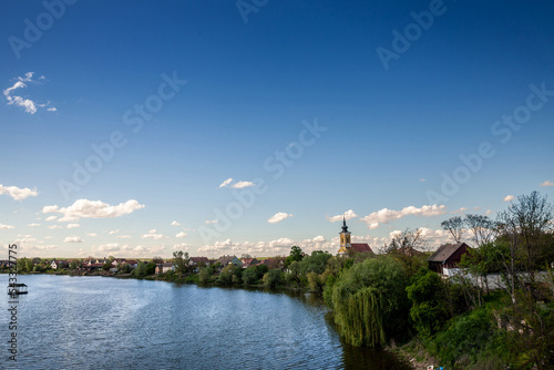 Panorama of a typical central European village in Vojvodina, in Morovic, between the rivers Bosut and Studva, in Western Serbia, near the city of Sid, in Srem region, in summer... photo