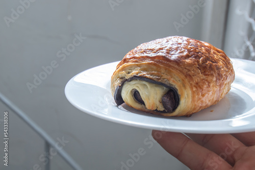 Pain au Chocolat on a white dish with natural light 