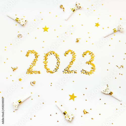 Obraz na płótnie New 2023 Year golden star shaped confetti celebration background. w salonie