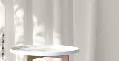 White wooden round side table with tropical plant and beautiful sun light and leaf shadow on white curtain for luxury beauty, organic, health, cosmetic, jewelry fashion product display background