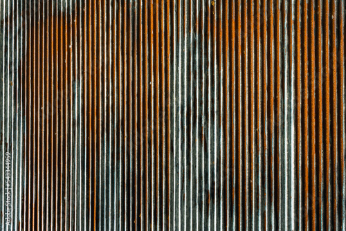 Artistic of old and rusty zinc sheet wall. Vintage style metal sheet roof texture. Pattern of old metal sheet. Rusting metal or siding. Corrosion of galvanized. Background and texture in retro concept