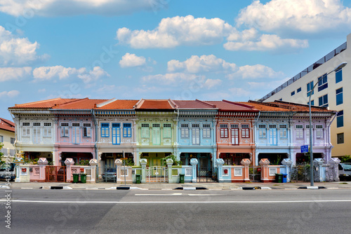 Colourful heritage facade of prewar houses with beautiful sky