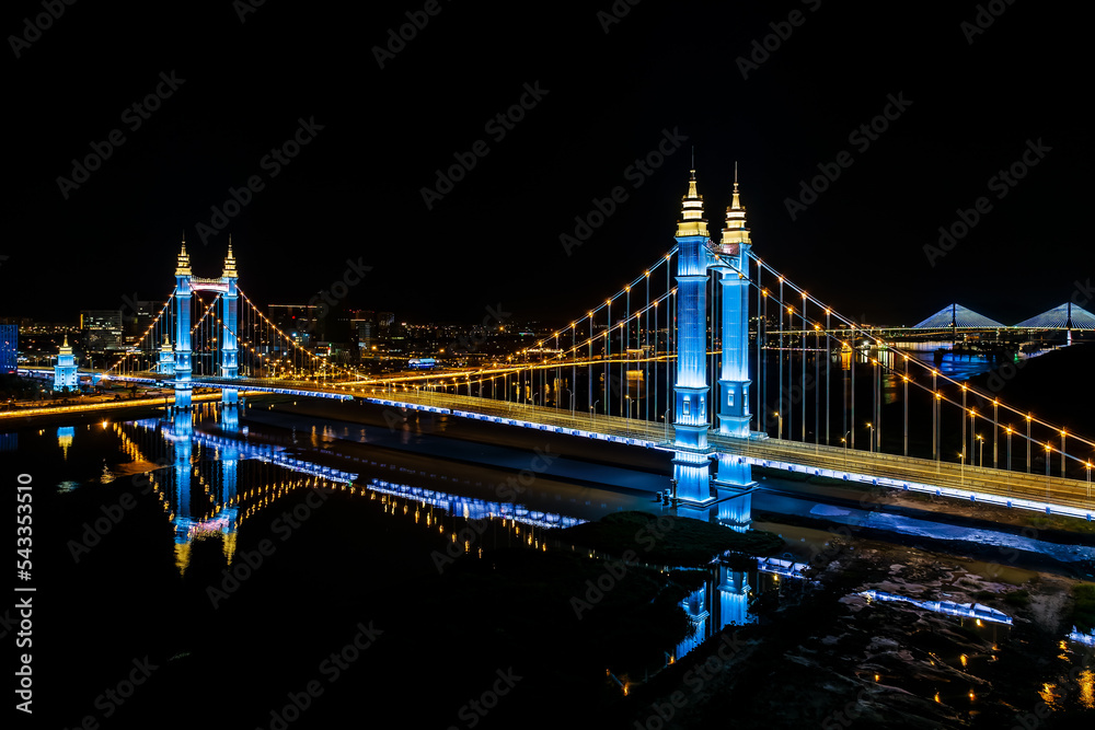 Fototapeta premium Beautiful bridge and river natural scenery at night in Zhoushan, Zhejiang, China.