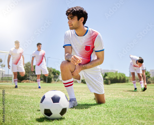 Sports, team and soccer training, stretching and warm up before game competition on field. Young athlete men, fitness workout and football exercise practice or sport lifestyle motivation outdoors