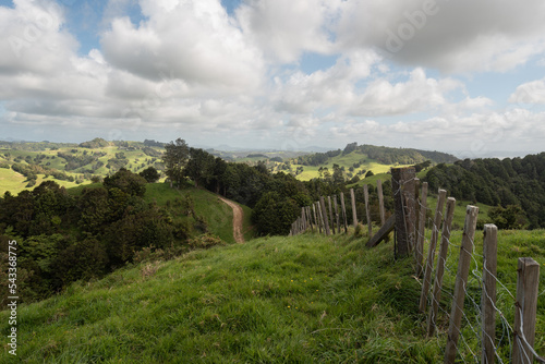 View across rolling farmland at the end of the Waipu Caves track, Whangarei District, Northland, New Zealand.