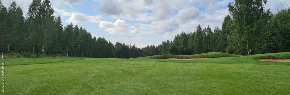 Beautiful green golf course. Golfing closeup. Summer day and golf