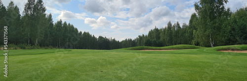 Beautiful green golf course. Golfing closeup. Summer day and golf