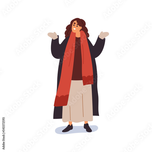 Happy woman in warm clothes enjoying winter. Female standing, wearing outerwe...