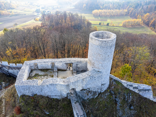 Obraz na płótnie The castle tower as seen from above. Bird's eye view, drone photo. Building, ruins, forest, autumn. w salonie
