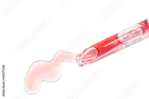 close up of pipette dropper with chemical acid peeling serum photo