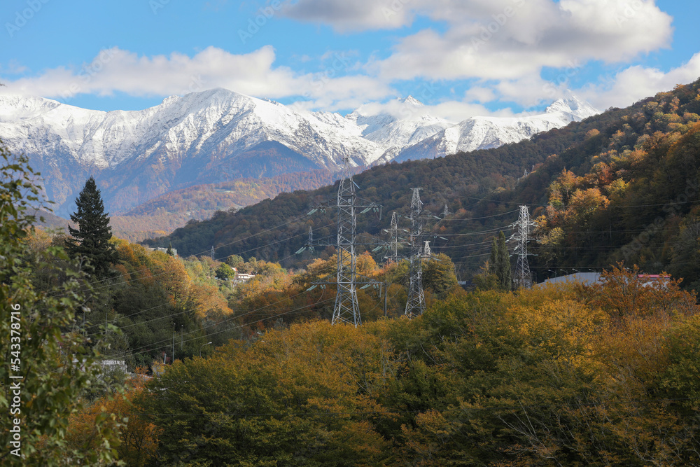 High voltage power lines in a beautiful mountains landscape.