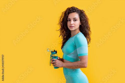 Obraz na plátně fitness sportswoman with sport water bottle, copy space