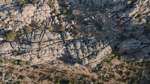 Aerial drone top down shot over rocky mountain tops  in Torcal de Antequera seen from above. Karstik rocks in Spain during evening time. photo