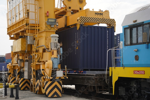 Khorgos, Kazakhstan - 09.22.2022 : Unloading of cargo containers in the dry port of Khorgos. photo