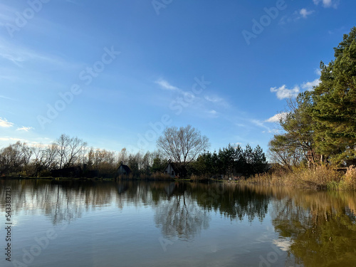Autumn mood landscape with lake and forest in the perfect sunny weather