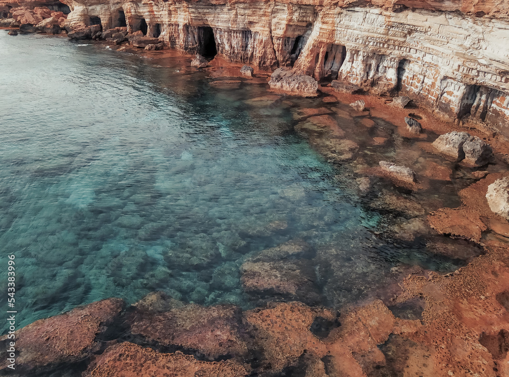 Sea caves near Cavo Greco. Mediterranean Sea coast. Beautiful cliffs with caves in Ayia Napa, Cyprus.