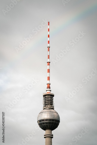 Vertical shot of TV tower against a cloudy sky in Berlin, Germany