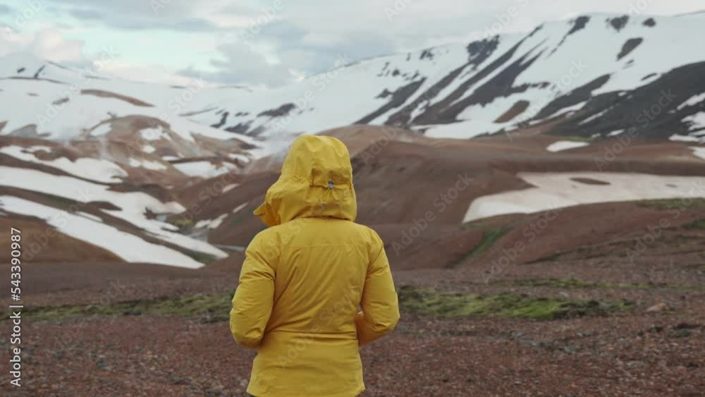 Beautiful asian woman walking on geothermal area in Kerlingarfjoll mountain on summer at Icelandic Highalands of Iceland Beautiful asian woman walking on geothermal area in Kerlingarfjoll mountain on summer at Icelandic Highalands of Iceland
